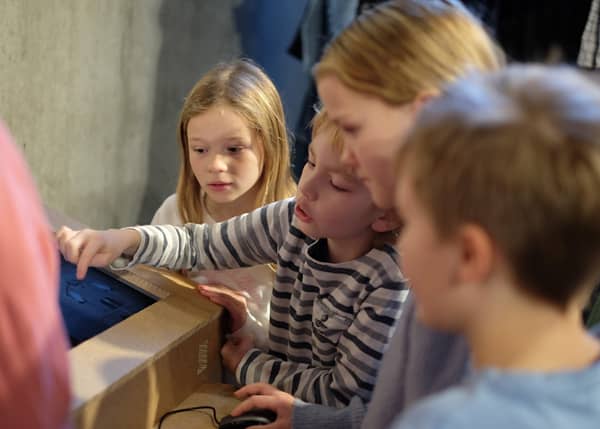 Students play a game on a computer screen