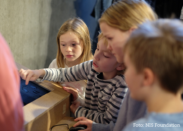 Students play a game on a computer screen